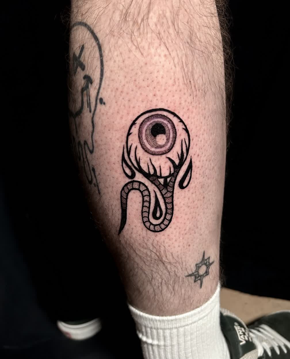 Trashed eyeball tattoo